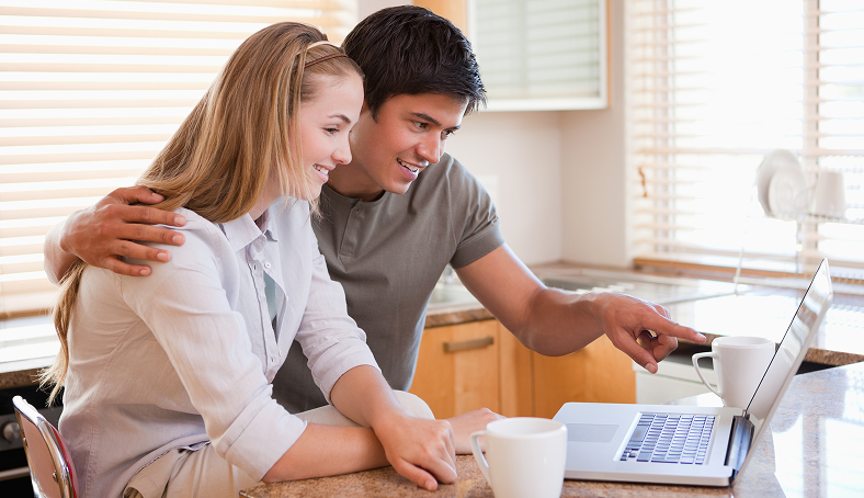 couple-having-coffee-while-using-laptop 1 Commercial Property Loans