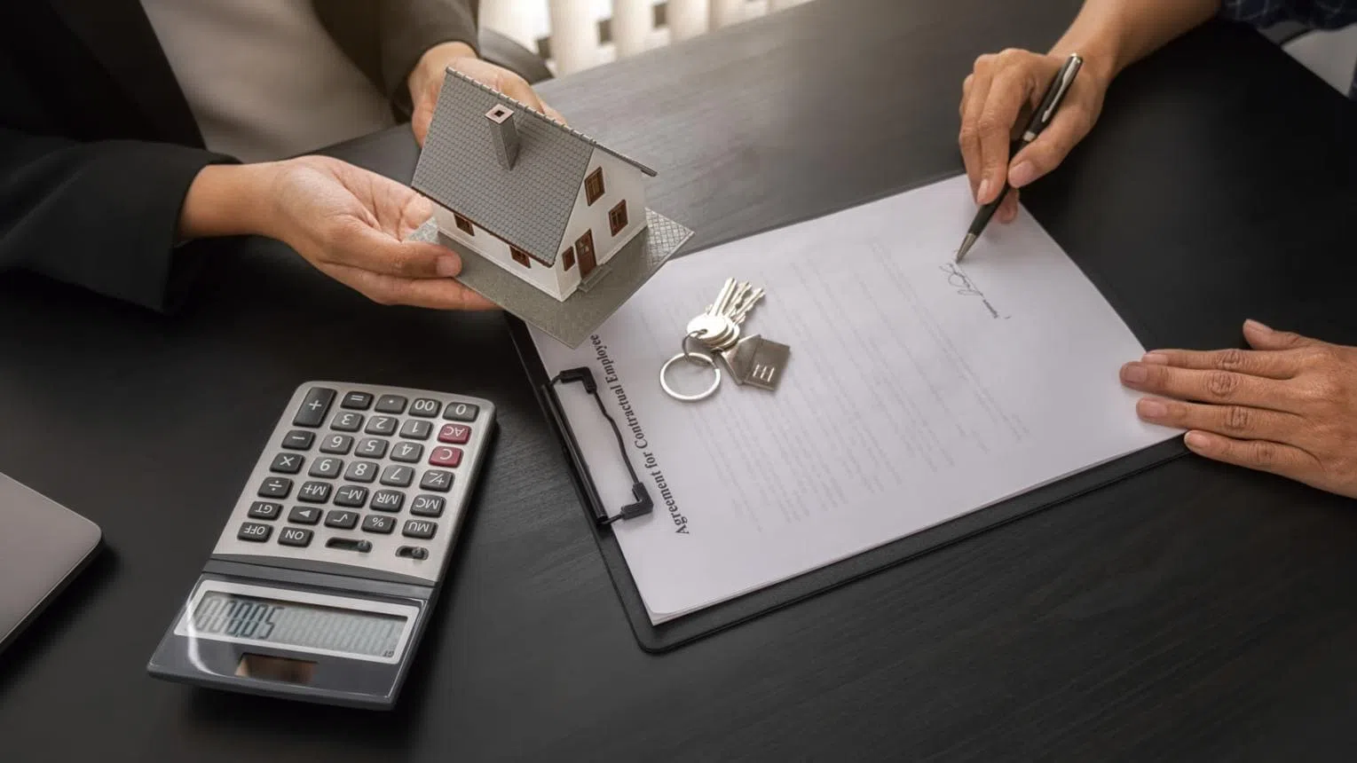 Bridging Loan Costs and Property Planning Property purchase documents, house keys and calculator used to plan bridging loan costs